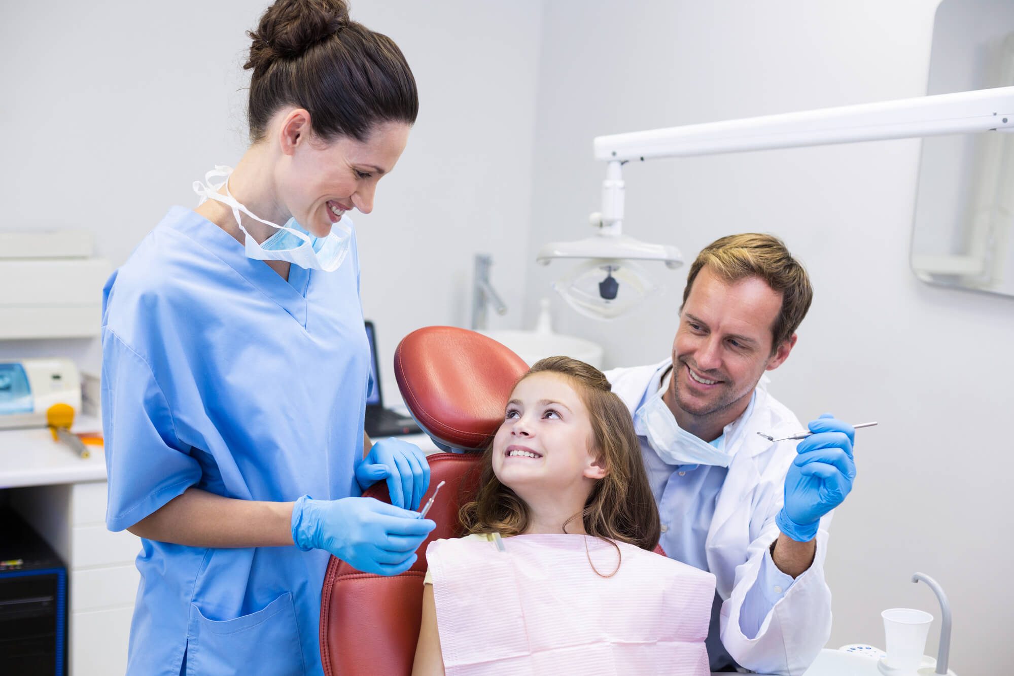 Dentists interacting with young patient